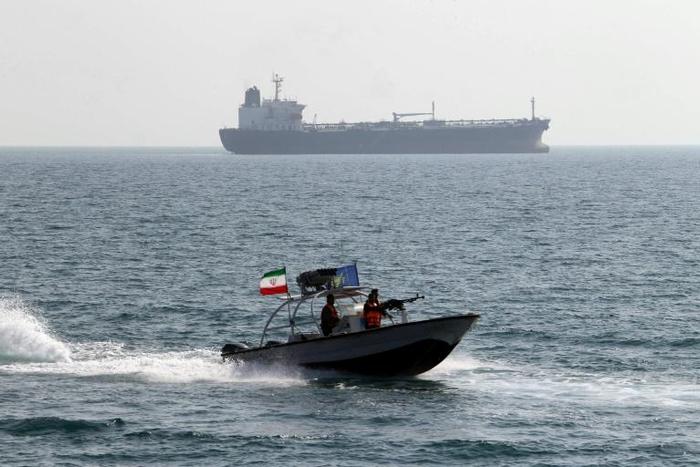 A file photo from July 2012 shows and Iranian Revolutionary Guard speedboat near the sensitive Strait of Hormuz