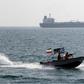 A file photo from July 2012 shows and Iranian Revolutionary Guard speedboat near the sensitive Strait of Hormuz