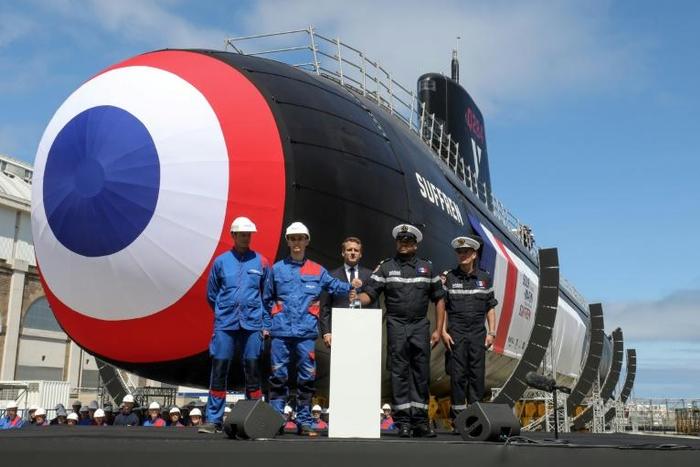 The first of France's new nuclear-powered attack submarines was launched in dry dock by President Emmanuel Macron