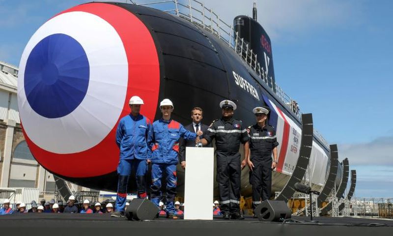 The first of France's new nuclear-powered attack submarines was launched in dry dock by President Emmanuel Macron