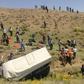 Rescue workers and Turkish soldiers carry injured migrants after a minibus accident in Van, eastern Turkey, on July 18, 2019. Seventeen people were killed and 26 wounded after a minibus carrying migrants overturned in eastern Turkey on July 18, the pri...