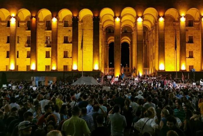 Tens of thousands rallied in central Tbilisi, demanding speaker Irakli Kobakhidze step down after a Russian lawmaker controversially addressed the country's parliament from the speaker's seat. 