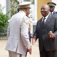 Bongo, centre, shakes hands at a ceremony to honour Gabon's first president