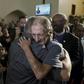 Antonio Basco greets well-wishers at the public memorial for his wife, Margie Reckard, a victim of the El Paso shooting