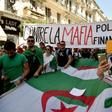 Protesting students hold a banner reading "against the politico-financial mafia" in Algiers on Tuesday