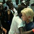 Frawley embraces Omar as they are reunited 15 years later on a migrant rescue ship