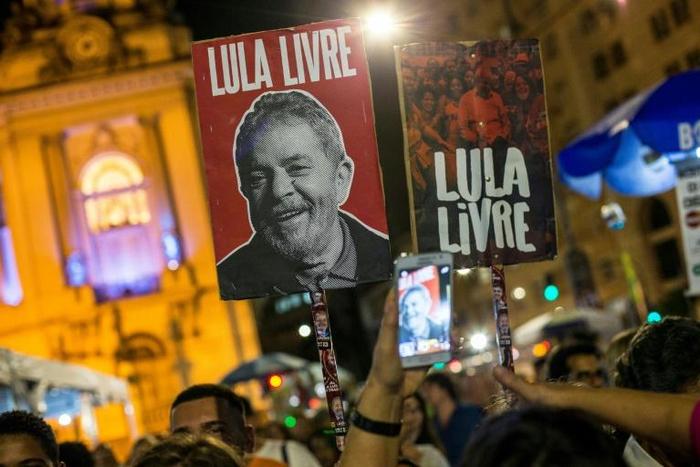 A sign with the image of former President Luiz Inacio Lula da Silva reading 'Lula Livre' (Free Lula) is carried by a demonstrator during an anti-government protest in May of this year