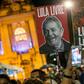 A sign with the image of former President Luiz Inacio Lula da Silva reading 'Lula Livre' (Free Lula) is carried by a demonstrator during an anti-government protest in May of this year