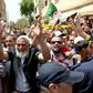 Protesters demonstrate as Algeria's former prime minister Abdelmalek Sellal is driven to custody in Algiers on June 13