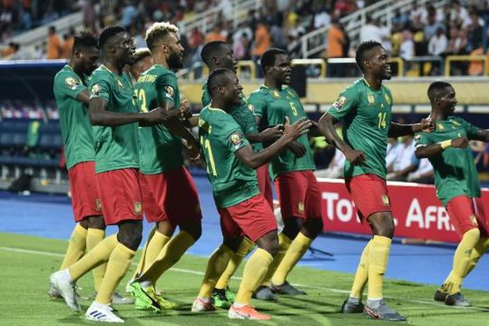 Cameroon's forward Stephane Bahoken (R) celebrates his goal