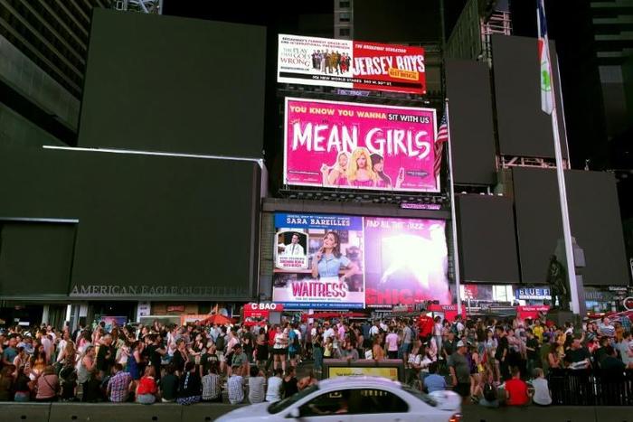 Billboards in Times Square are dark during a power outage in New York on July 13, 2019