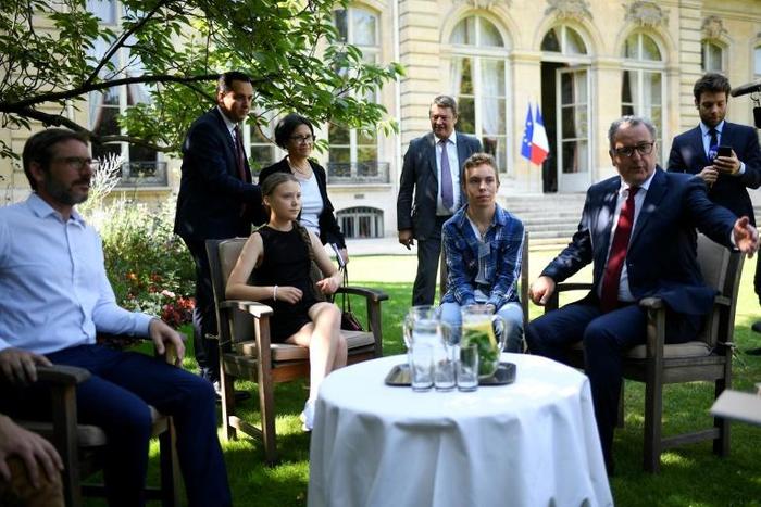 Thunberg (2nd L) was received by President of the French National Assembly Richard Ferrand (R) in the garden of the Hotel de Lassay ahead of her visit of the French National Assembly