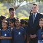 Brazilian President Jair Bolsonaro, seen during a May 21, 2019 event with a school group in Brasilia, has defended the practice of child labor though it is banned in his country