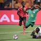 Uganda goalkeeper Denis Onyango fouls Senegal forward Sadio Mane, whose penalty kick was saved in an Africa Cup of Nations last-16 match in Cairo