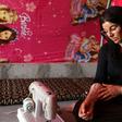 Yazidi survivor Layleh Shemmo looks at a tatoo bearing the names of her two sons at a tent in the Khonke displacement camp in northwestern Iraq on June 24, 2019