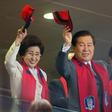 Lee Hee-ho and her late husband Kim Dae-jung wave during the 2002 World Cup in Seoul