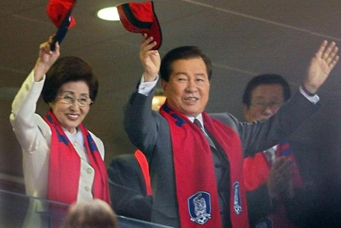 Lee Hee-ho and her late husband Kim Dae-jung wave during the 2002 World Cup in Seoul