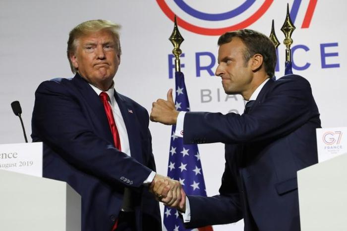 France's President Emmanuel Macron, right, with US President Donald Trump at the close of the G7 conference in Biarritz, France, on Monday