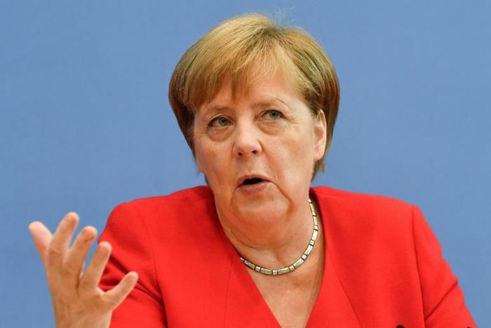 German Chancellor Angela Merkel rebuked Donald Trump's xenophobic tweets, saying that "people from different (origins) contributed to what makes the country great"