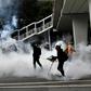 Riot police fired dozens of rounds of tear gas in Hong Kong's Yuen Long district after tense standoffs with protesters
