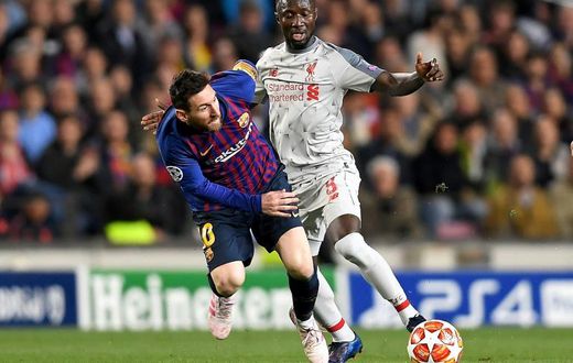 Guinea star Naby Keita (R) playing for Liverpool against Lionel Messi of Barcelona during a UEFA Champions League semi-final last month
