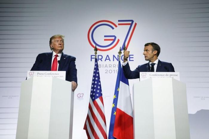 France's President Emmanuel Macron (R) and US President Donald Trump deliver a joint press conference in Biarritz, south-west France on August 26, 2019, on the third day of the annual G7 Summit