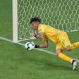 Peru goalkeeper Pedro Gallese guesses the right way to save Uruguay forward Luis Suarez's penalty during the Copa America quarter-final shoot-out