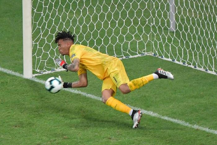 Peru goalkeeper Pedro Gallese guesses the right way to save Uruguay forward Luis Suarez's penalty during the Copa America quarter-final shoot-out