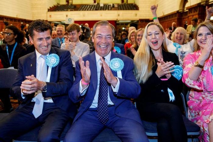 Nigel Farage (centre) hopes his Brexit Party can build on its success in the European Parliament elections to win a seat in the British parliament on Thursday in Peterborough