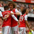 Arsenal defender David Luiz congratulates Alexandre Lacazette