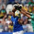 Italy's Cristiana Girelli scores despite the efforts of Jamaica goalkeeper Sydney Schneider