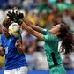 Italy's Cristiana Girelli scores despite the efforts of Jamaica goalkeeper Sydney Schneider