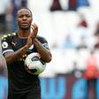 Raheem Sterling carries the match ball after scoring a hat-trick for Manchester City against West Ham