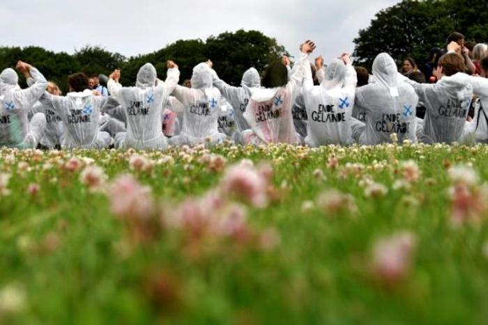 European climate activists, in their trademark white overalls, take part in a training in Viersen, western Germany, on the eve of their mass action aiming to block a huge open-pit coal mine.
