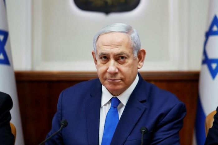 Israeli Prime Minister Benjamin Netanyahu on Sunday warned the head of Lebanon's Tehran-backed Hezbollah that "crushing" retaliation would follow any attack