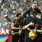 Liverpool players and staff celebrate after beating Chelsea on penalties to win the Super Cup in Istanbul