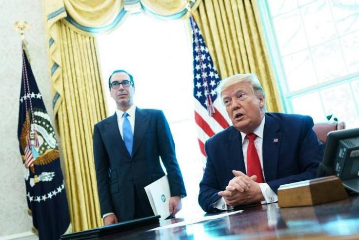 US President Donald Trump speaks before signing an executive order for sanctions on Iran's supreme leader in the Oval Office of the White House on June 24, 2019 as US Treasury Secretary Steven Mnuchin looks on.