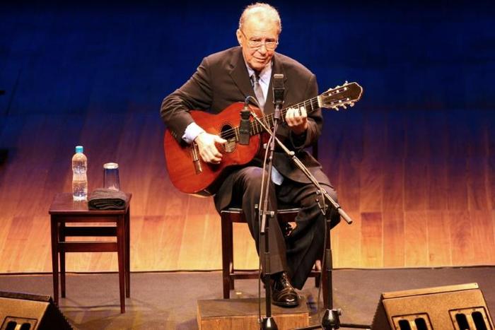 In this file photo taken on August 14, 2008, Brazilian singer and composer Joao Gilberto, a pioneer of bossa nova music, performs in Sao Paulo, Brazil; his son announced his death on July 6, 2019