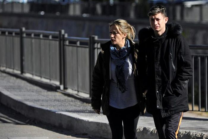 Argentinian Ezequiel Villalonga (R), 18, a victim of sexual abuse, walks with his mother Natalia along a street in Mendoza, Argentina