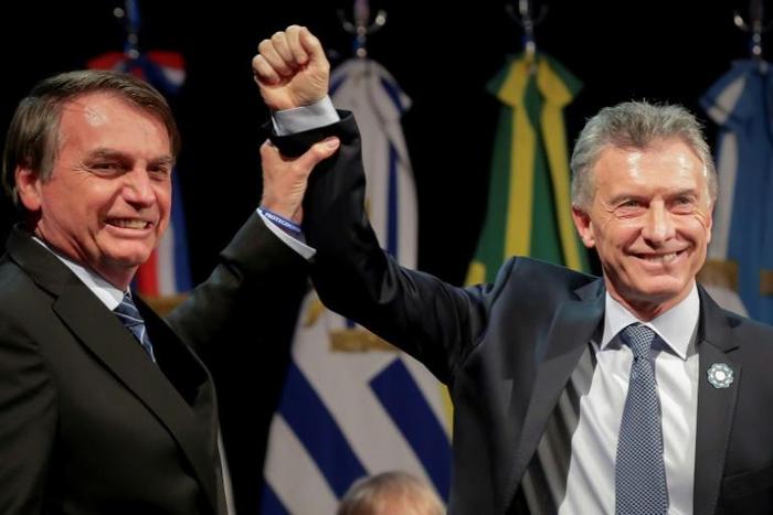 Brazil President Jair Bolsonaro (left) is taking over the Mercosur presidency from his Argentina counterpart and right-wing ally Mauricio Macri
