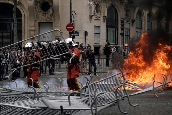 Analysts had believed that the yellow vest movement had lost momentum, but dozens of protestors knocked down security barriers erected for the parade and set fire to refuse bins
