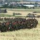 British troops march through a cornfield on the border with neighbouring Macedonia, headed into Kosovo on 11 June 1999 as part of a NATO ground force