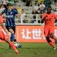 Inter Milan's Samuele Longo (C) scores the equalising goal past Paris Saint-Germain players during their International Super Cup football match in Macau on July 27, 2019