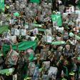 Supporters of then Iranian presidential candidate Mir Hossein Mousavi wave green flags - his campaign colour - at a pro-reform rally in Tehran on June 9, 2009