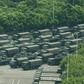 Military trucks and armored personnel carriers outside the Shenzhen Bay stadium in Shenzhen, bordering Hong Kong