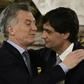 Argentina's President Mauricio Macri (L) congratulating his new finance minister Hernan Lacunza, who now faces the task of stabilizing Argentina's currency