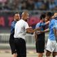 Pep Guardiola gives intructions to his Manchester City players on the sideline in Nanjing