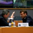 European Central Bank President Mario Draghi and France's President Emmanuel Macron (R) speaking before a meeting