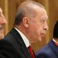Erdogan (C) supports the internationally recognised national unity government in Tripoli