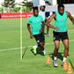 Nigeria forward Samuel Kalu (L) is in a "stable condition" after collapsing during training due to dehydration, the Egyptian Football Association said, amid a sweltering start to the Africa Cup of Nations